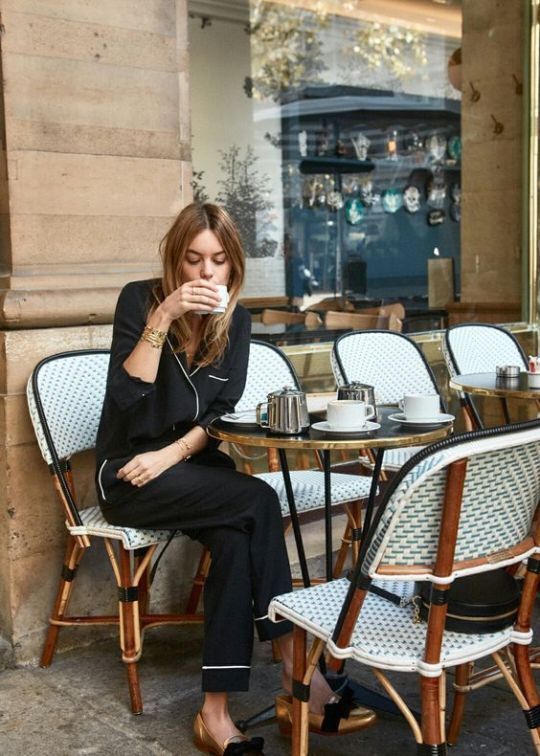 woman drinking coffee in french cafe